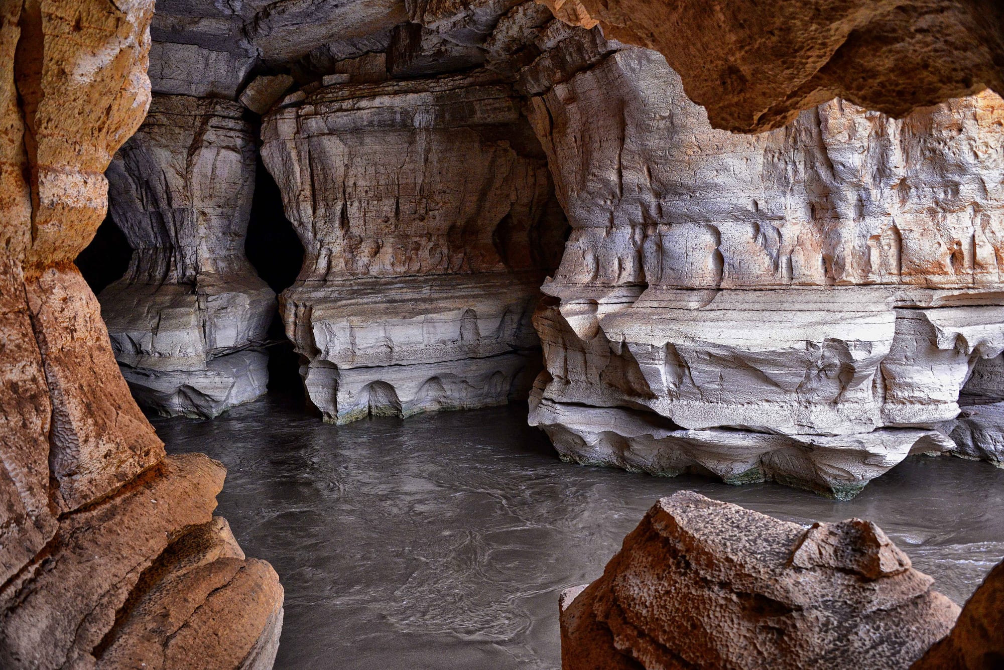 Cave passages, columns, river sound, and sacred heritage